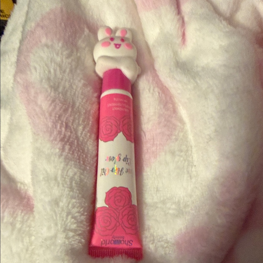 Rose hip oil lip gloss with bunny  topper
